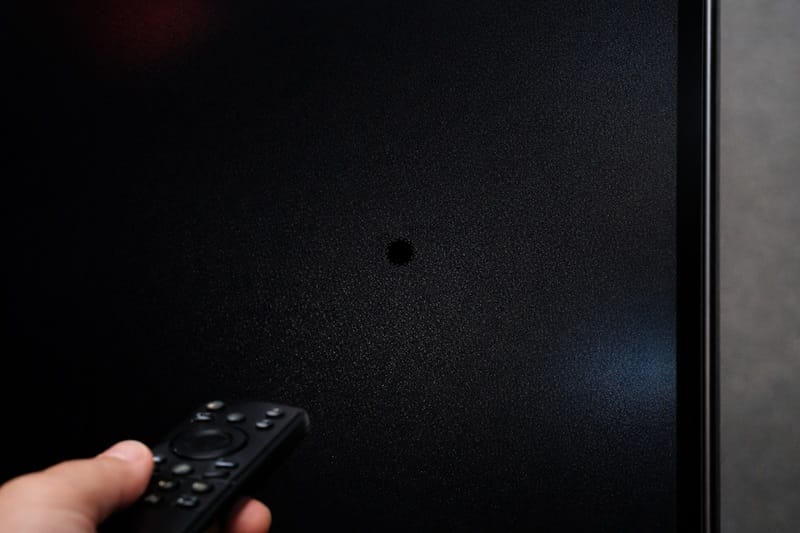 sony oled dead pixels close-up of black dot on dark screen